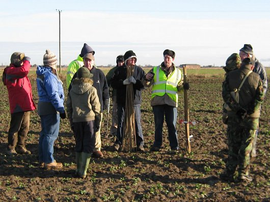 Dave Start, Director of Heritage Lincolnshire, instructs members of the public in the dark arts of field walking.